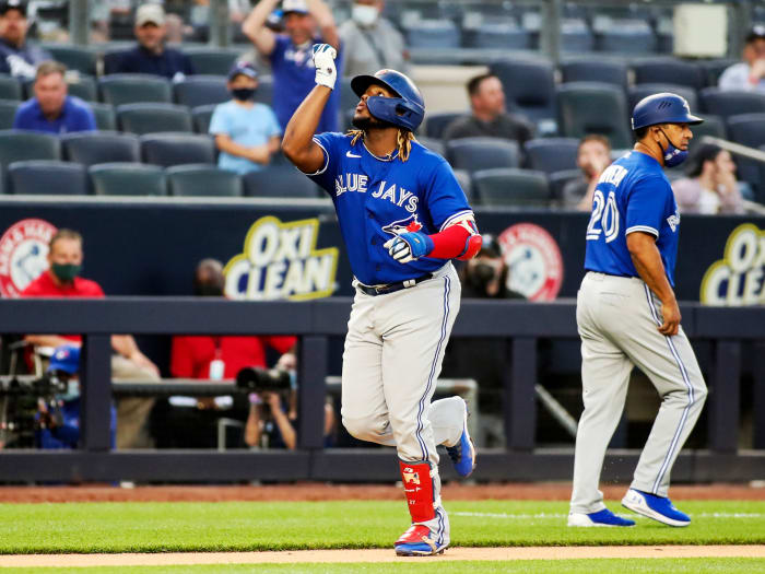 May 25, 2021; Bronx, New York, USA; Toronto Blue Jays first baseman Vladimir Guerrero Jr. (27) points to the sky after hitting a two run home in the third inning against the New York Yankees at Yankee Stadium.